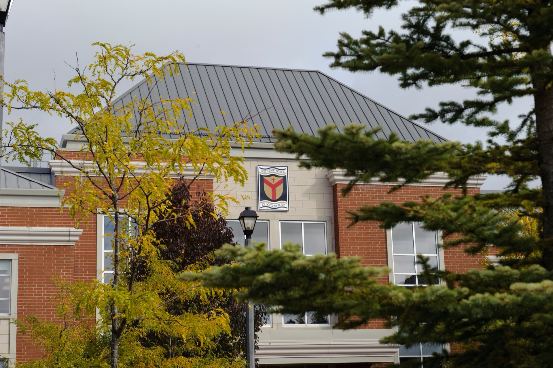 The HTS crest on the school's main building